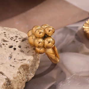 Macro shot of gold-plated stainless steel bubble ring with spherical cluster design