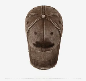 Top view of a vintage washed dark brown baseball cap with embroidered lettering details