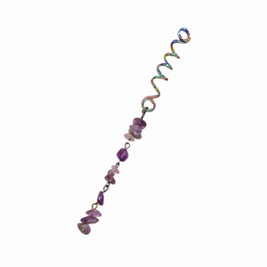 Detailed view of rainbow spiral hair coil with purple natural stone pendant accessory