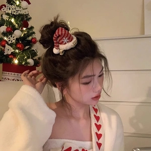 Red Christmas hat headband with white snowflake patterns and plush pom-poms for festive wear