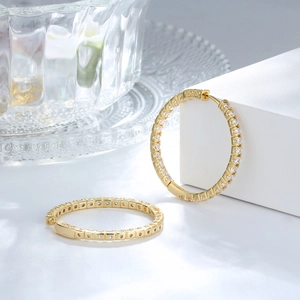 Detailed view of gold plated hoop earrings with micro-pave white cubic zirconia stones