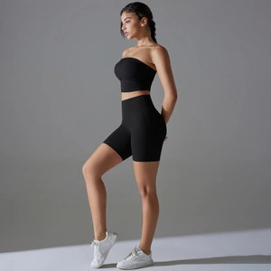 Side view of black ribbed tube top and high-waist fitness shorts for women gym yoga set