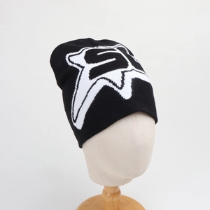 Detail of black knit beanie featuring a white jacquard graphic logo on thick fabric