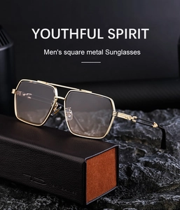 Men's square metal sunglasses in gold finish with leather case on black rock surface