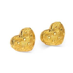 Detail of heart-shaped gold stud earrings with intricate woven texture and metal beads