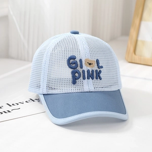 Detailed close-up of light blue summer mesh cap with GIRL PINK embroidery and bear logo