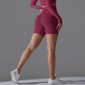 Detail view of seamless high-waist berry yoga shorts with scrunch butt lifting design