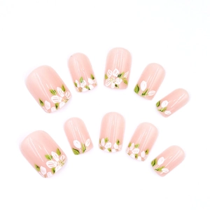 Pink floral press-on nails with white flowers and green leaves in square-oval shape