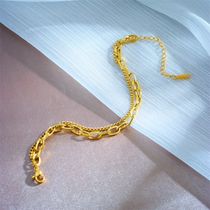 Double-layer gold stainless steel chain bracelet with chunky oval links and fine mesh chain