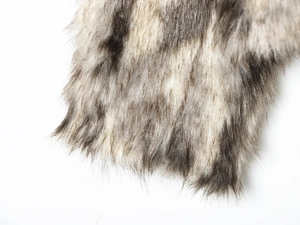 Close-up of high-quality faux fur texture in natural grey and brown long fibers