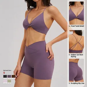 Purple yoga set with thin strap V-neck sports bra and high-waisted gym shorts
