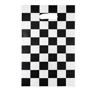 Racing party favor bags with black and white checkered pattern and die-cut handles