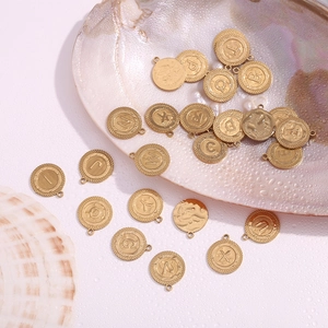 Detail of 18K gold plated striped round alphabet pendants for DIY jewelry making
