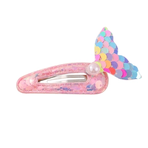 Detailed view of kids mermaid tail hair clip with pink sequins and pearl accent