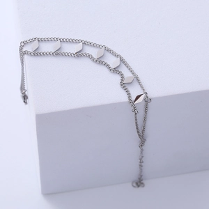 Minimalist double-layer stainless steel chain bracelet featuring polished diamond charms