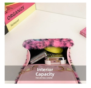 Internal capacity of leopard print plush bag showing storage for phone and accessories
