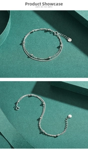 Detail of S925 sterling silver double-layer chain bracelet with beads and clasp