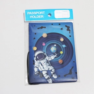 Blue passport holder with 3D astronaut design and elastic band closure in packaging