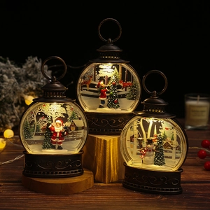 Vintage bronze Christmas lanterns with warm LED lights and festive winter scene figurines