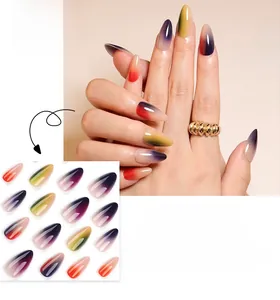 Detail view of almond shape press-on nails with vibrant rainbow gradient spray paint finish