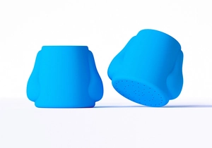 Detail showing the bottom circular spray holes of this blue portable silicone water bottle cap