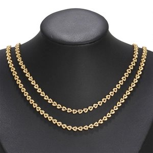 Double-layer stainless steel gold heart chain necklace displayed on a black neck mannequin