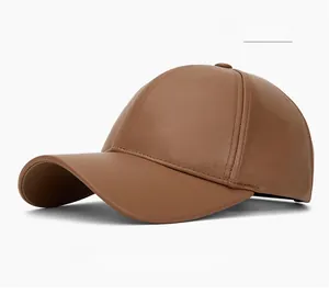 Detail of khaki PU leather baseball cap showing fine grain texture and 6-panel stitching