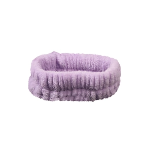 Close-up of soft purple coral fleece headband for facial cleansing and skin care