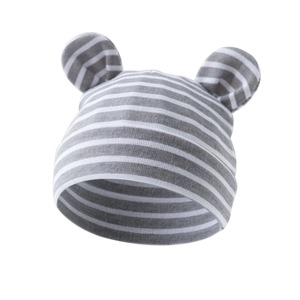 Detail showing soft cotton knit texture and cute round ears on striped baby beanie