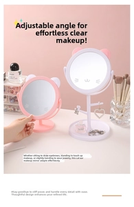 Detail of cat-ear desktop makeup mirror with jewelry hooks and storage base tray
