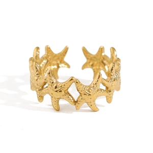 Golden starfish ring with intricate texture details, minimalist ocean style ocean design