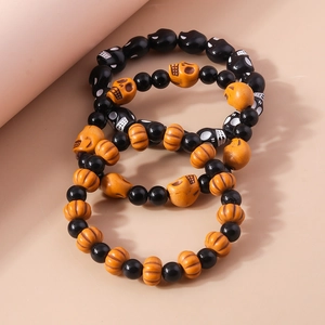 Halloween beaded bracelet set with orange pumpkins and black skulls charms
