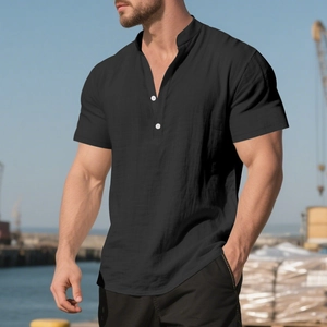 Outdoor close-up of men's black linen short sleeve henley shirt with white buttons