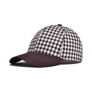 Classic houndstooth baseball cap with a brown visor and vintage checkered pattern