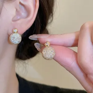 Elegant gold plated round stud earrings with shimmering pave cubic zirconia stones
