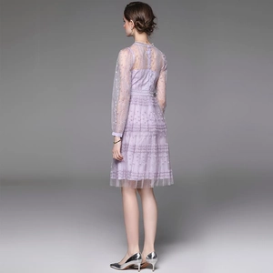 Back view of a purple lace mesh long-sleeve dress with layered embroidery and round neck