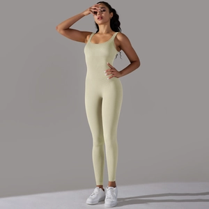 Detail of light green ribbed seamless yoga jumpsuit showing slimming knit texture