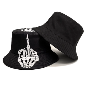 Black cotton bucket hat with white skeleton hand print and plain black reversible style