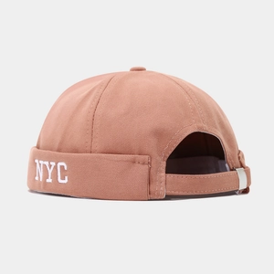 Detail of NYC embroidered miki hat in brown cotton with adjustable metal buckle strap