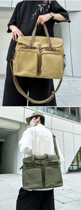 Macro detail of khaki and olive canvas messenger bags with multiple pockets and leather tabs
