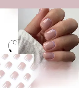 Detail view of pink base French press-on nails with white tips and JP1958 model code
