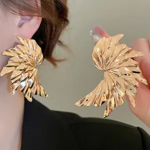 Statement gold-plated crinkled wing earrings featuring high-polish finish and bold style