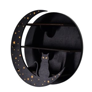 Close-up of black wooden moon cat shelf with golden stars and multiple tiers for crystal storage