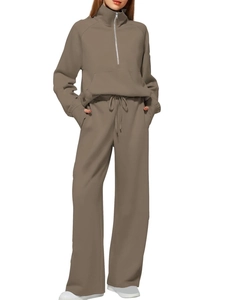 Detail of half-zip sweatshirt with front pocket and wide-leg drawstring sweatpants set