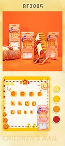 Detail of children's press-on nails featuring cute yellow smile faces and flower patterns