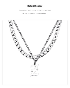 Close-up of silver stainless steel double layer Cuban chain necklace with letter Z pendant