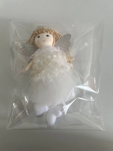 Detail of handmade Christmas angel doll with glittery silver wings and white mesh skirt