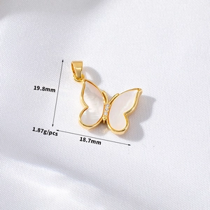 Detailed view of butterfly pendant in gold with white shell inlay, size 19.8x18.7mm