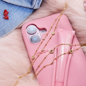 Double-layered stainless steel heart bracelet with white diamonds and matte pink phone case
