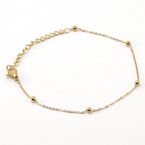 Minimalist gold stainless steel beaded bracelet with lobster clasp on a clean white background